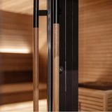 Stylishly designed outdoor sauna with all-glass doors for a luxurious family spa experience